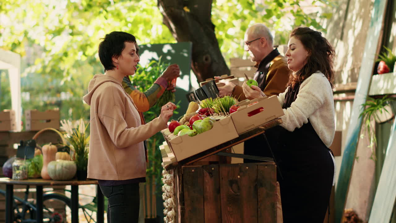 People buying fresh local produce at farmers market