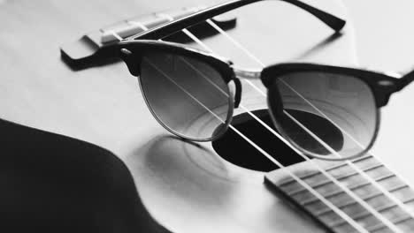 ukulele and earbuds in black and white