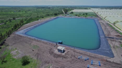 Irrigation-Reservoir-Filled-With-Water-At-Greenhouse-Farm-In-East-Africa