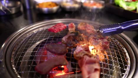 grilled pork and beef on a barbecue