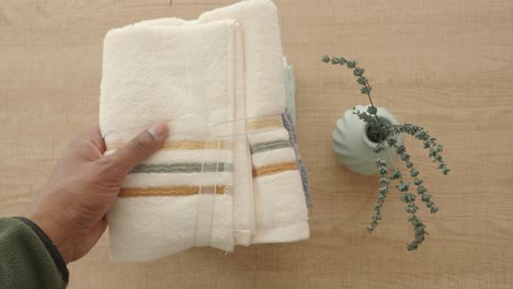 stacked towels and plant decor on a table
