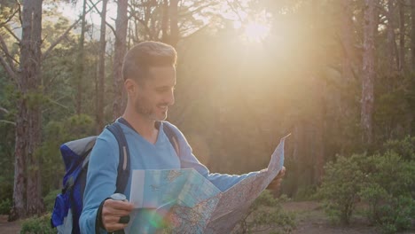 male traveler reading map