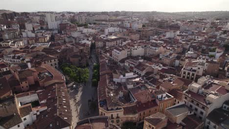 Aerial-view-orbiting-across-Cáceres-historic-UNESCO-world-heritage-cityscape-skyline,-Extremadura