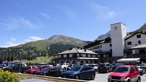 cars parked in a mountain town lot