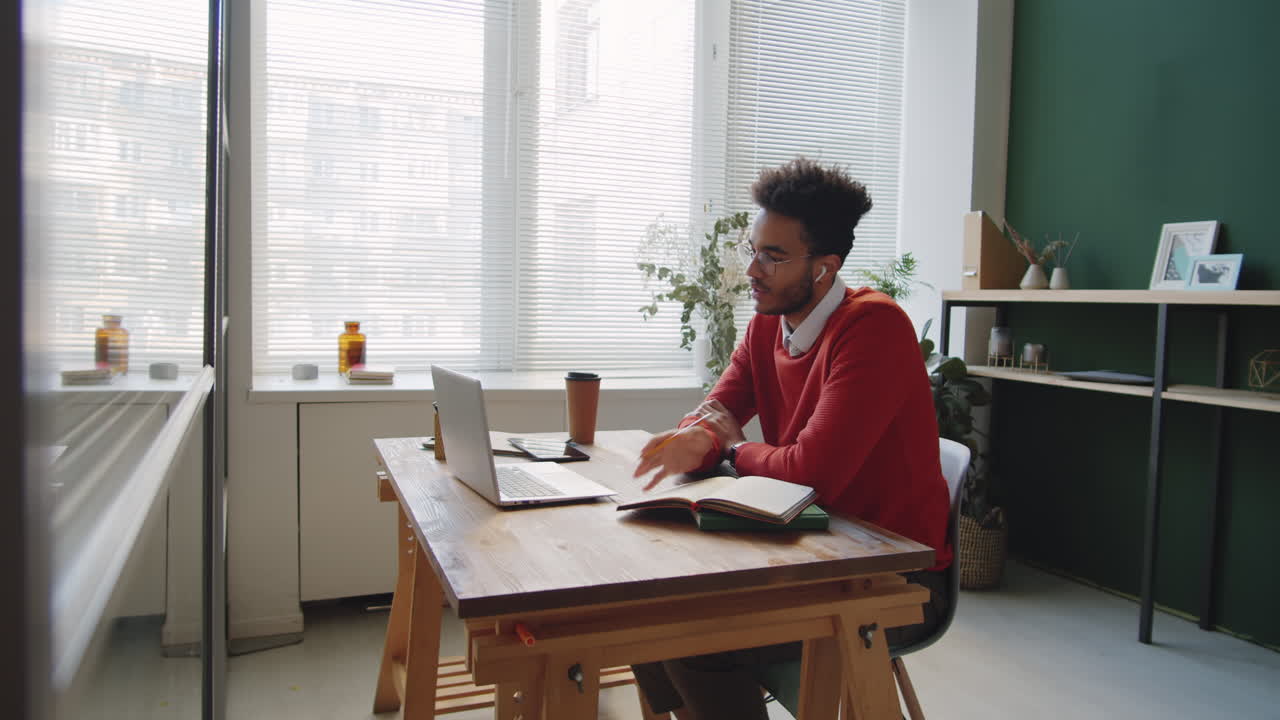 Man studying online from home office