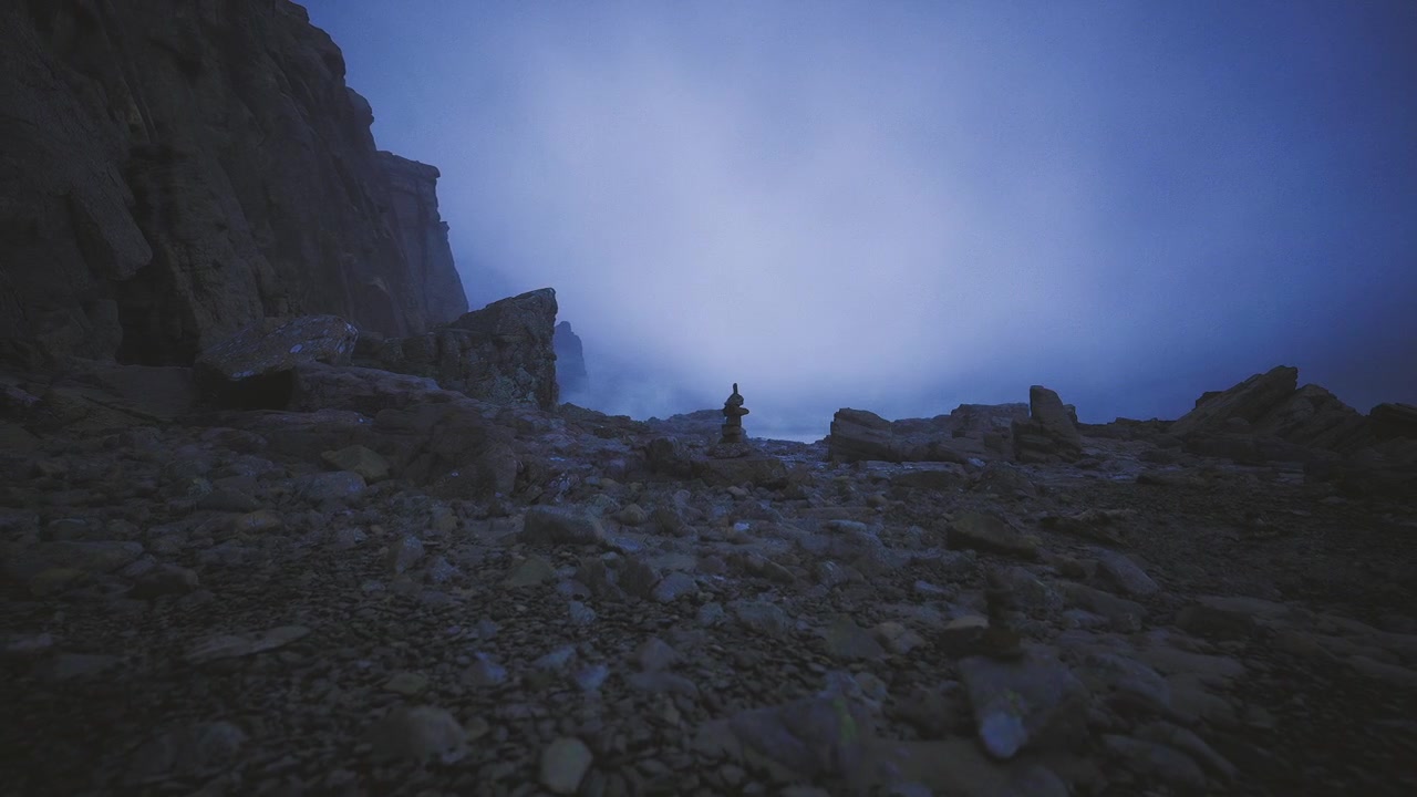 Isolated rocky pillar amidst turbulent sky and gravel terrain