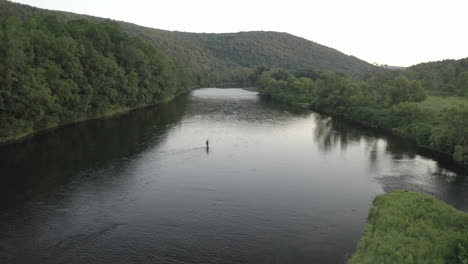 drone pedestal pull back reveal footage of fly fishing at west branch delaware river