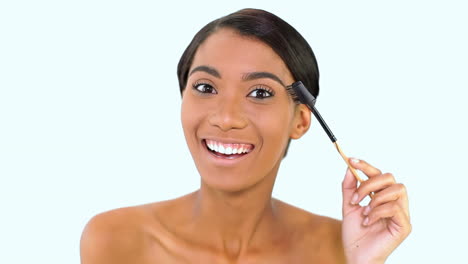 Woman-brushing-her-eyebrows-