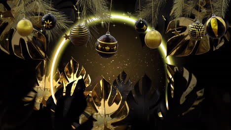 swinging black and gold christmas baubles over leaves and glowing ring of light on dark background