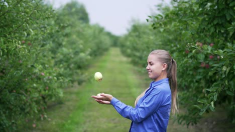 the girl in the apple orchard is played with apples in her hands