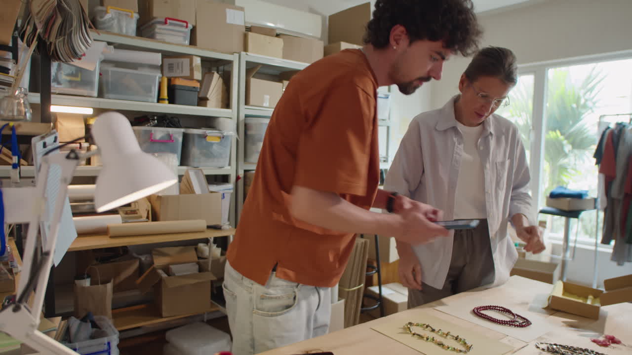 Coworkers Photographing Jewelry for Online Marketplace