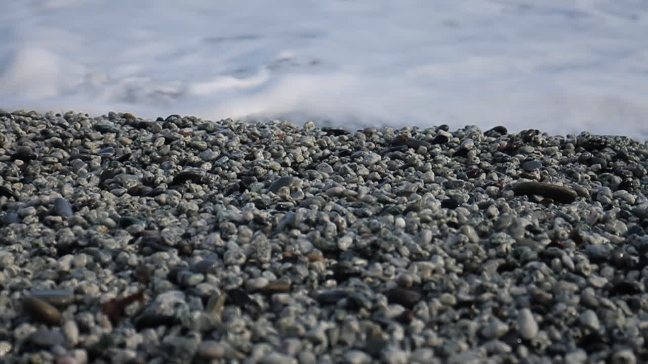 Waves Crashing on a Pebble Beach