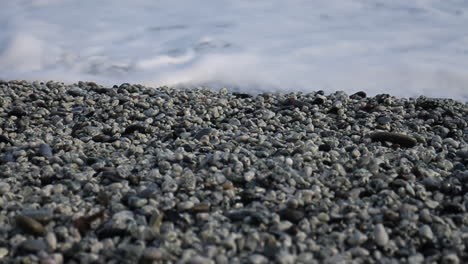 waves crashing on a pebble beach