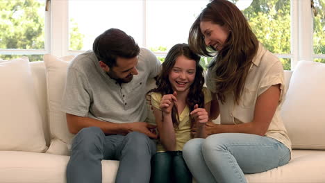 Parents-playing-with-daughter