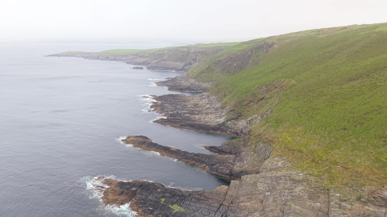 Rugged Clifftops and Atlantic Ocean Waves Along Ireland’s Coastline in County Cork