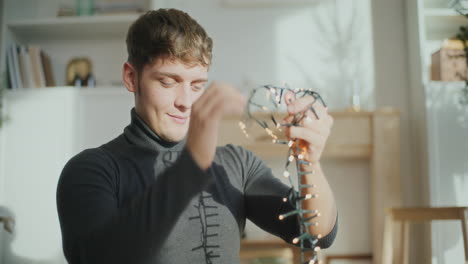 man with illuminated lights for christmas decoration