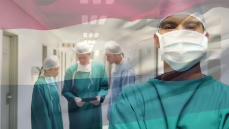 animation of flag of netherlands waving over surgeons in operating theatre