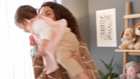 excited mother kiss happy baby in the air