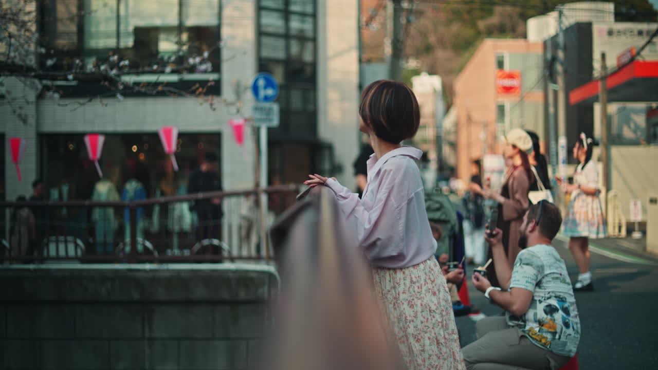 A group of people on the street in a city