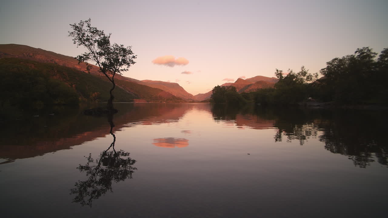Serenity landscape during dusk, water reflects scenery of sky and tree like a mirror in a calm, tranquil and peaceful scene