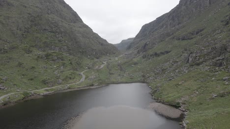 tranquil lake from the gap of dunloe valley in killarney national park, county kerry, ireland