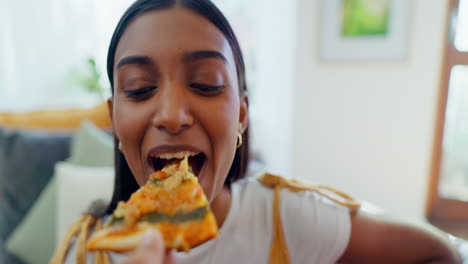 Pizza,-face-and-a-hand-feeding-a-woman-on-a-sofa