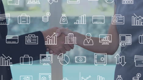 multiple digital icons against mid section of businessman and businesswoman shaking hands at office