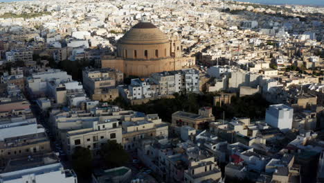 The-Sanctuary-Basilica-of-the-Assumption-of-Our-Lady-In-Mosta,-Malta---aerial-drone-shot