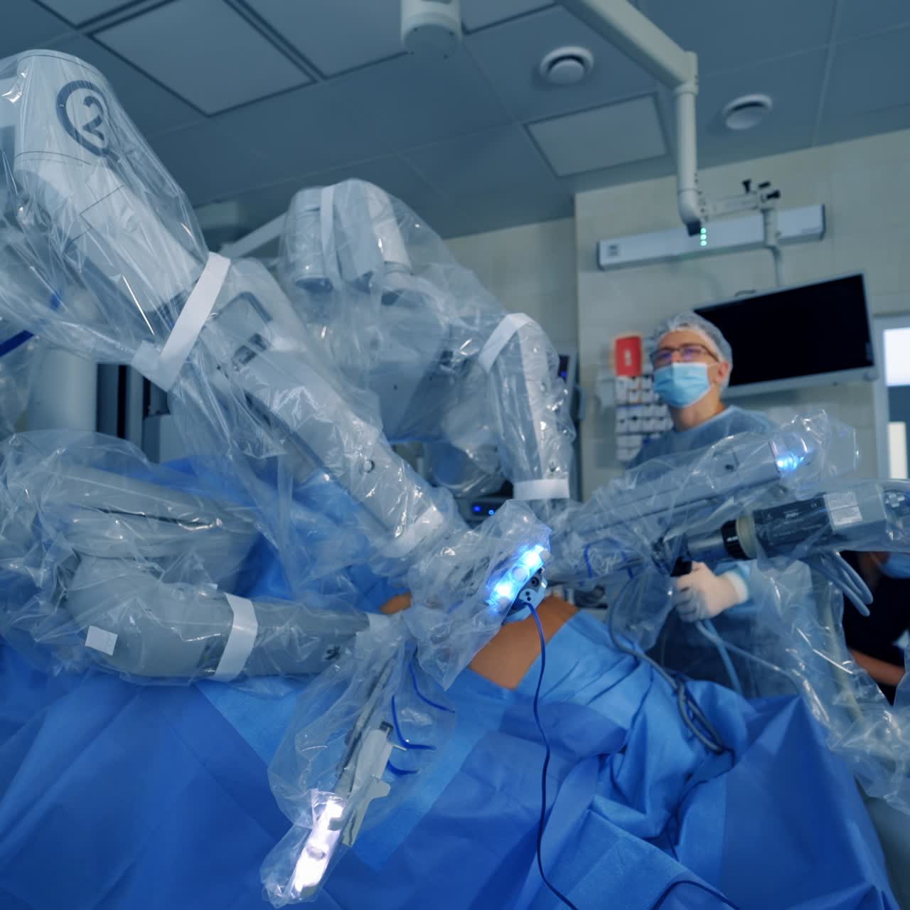 The process of carrying out a surgical operation using a modern robotic surgical system. Medical robot. Minimally invasive robotic surgery.