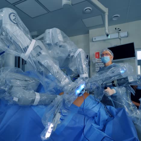 the process of carrying out a surgical operation using a modern robotic surgical system. medical robot. minimally invasive robotic surgery.