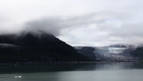 glacier and mountain with cloud on top, in glacier bay national park,alaska