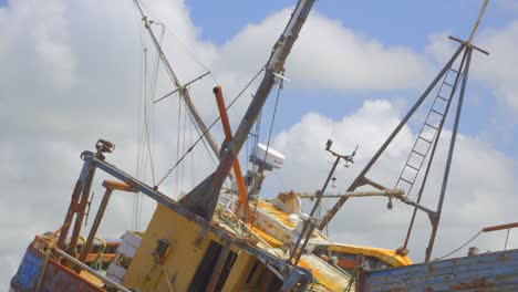 Rusty-shipwreck-with-clouds-racing-by-behind