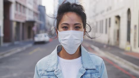 Woman-wearing-medical-coronavirus-mask-looking-at-camera