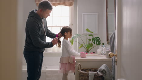 father-brushing-daughters-hair-in-bathroom-cute-little-girl-getting-ready-in-morning-loving-father-enjoying-parenthood-caring-for-child