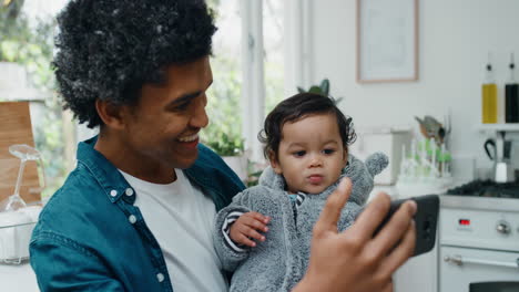 father-and-baby-video-chat-using-smartphone-happy-dad-holding-toddler-sharing-fatherhood-lifestyle-with-friend-on-social-media-enjoying-mobile-technology-4k