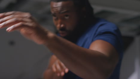 close up of male athlete or boxer training in gym sparring and warming up preparing for sports event or fight 1