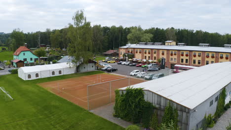 luxurious sports cars parked at tennis resort with courts, czechia