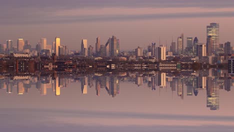 day to night timelapse of the london skyline perfectly reflecting itself