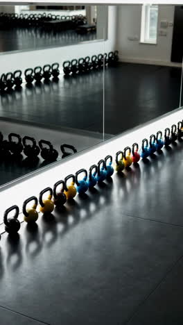 colorful kettlebells in a modern gym