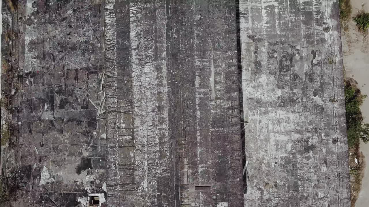 Ruined roof of an old abandoned factory. Aerial view