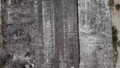 ruined roof of an old abandoned factory. aerial view