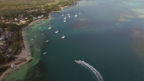 Aerial-bird-eye-view-of-coast-with-sand-beach-and-transparent-water-of-Indian-Ocean-Mauriticus-Island