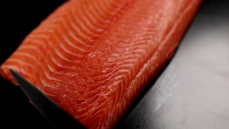 slicing fresh salmon