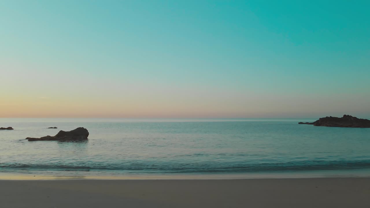 Tracking shot along Fuengirola beach sea, Sun Coast, Spain. Low angle