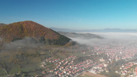 View of Visoko City next to the Bosnian pyramid of sun at sunny morning. Super wide aerial wide shot.