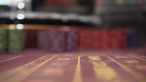 poker chips on table, extreme closeup, sliding camera, dooly shot