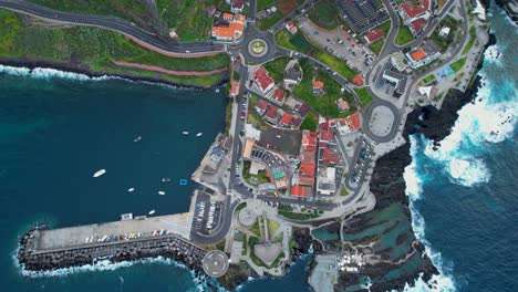 volcanic rock pools and harbor of porto moniz on rugged madeira coastline