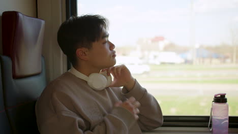 man listening to music in the train