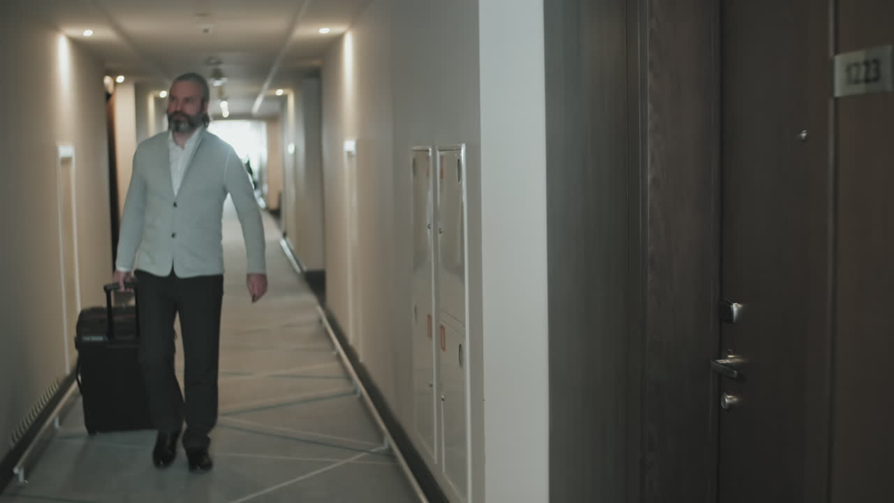 Businessman Entering Hotel Room