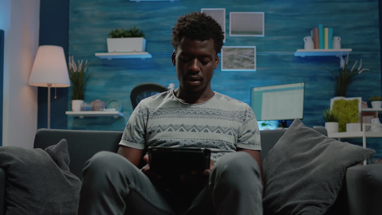 Young freelancer using digital tablet with touch screen for work